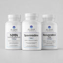 Three bottles of Dr. Emil Nutrition supplements on a gray background