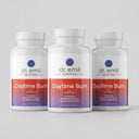 Three bottles of Dr. Emil Nutrition Daytime Burn supplement on a light gray background