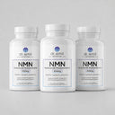 Three bottles of Dr. Emil NMN supplements on a light gray background