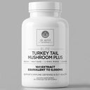 Supplement bottle labeled 'Elite Turkey Tail Mushroom Plus' by Dr. Emil Nutrition on a gray background
