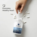 Dr. Emil 5-HTP Plus supplement bottle with a hand picking up pills on a light background