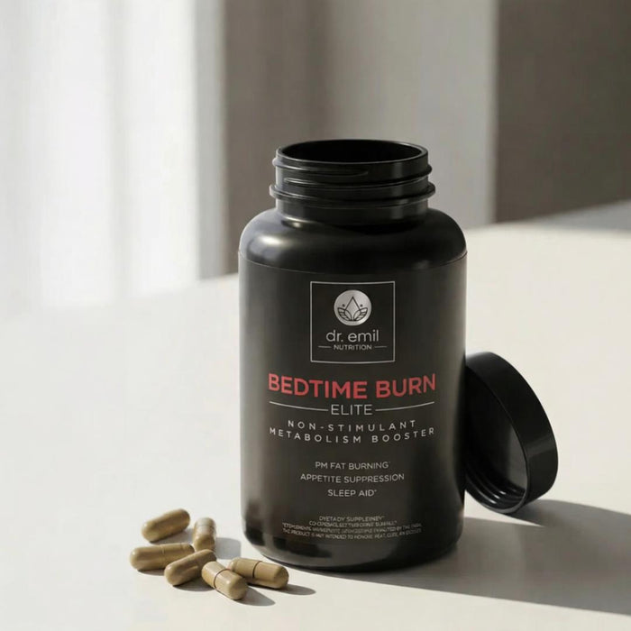 Black supplement bottle labeled 'Dr. Emil Bedtime Burn Elite' on a light surface with scattered capsules.