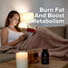 Woman reading a book on a couch with a candle and glass of tea on a table, text 'Burn Fat And Boost Metabolism' above.