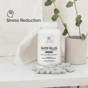Bottle of SHTP Plus 200MG supplement with capsules on a light surface, featuring 'Stress Reduction' text.