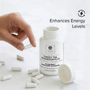 Bottle of Turkey Tail Mushroom Plus supplement with capsules and a hand holding a capsule on a light background.