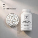 Supplement bottle labeled 'Elite Turkey Tail Mushroom Plus' with a bowl of capsules on a neutral background.