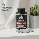 Bottle of Goliath by Dr. Emil Arginine 3000 supplement with capsules on a white surface, cactus in the background.
