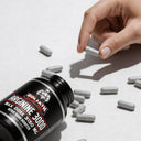 Bottle of Arginine 3000 supplement with capsules on a light background