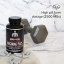 Bottle of Goliath by Dr. Emil Arginine Plus with pills on a marble surface