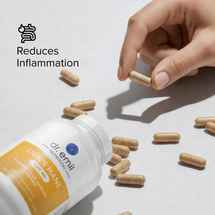 Hand picking a supplement capsule from a bottle labeled 'Lion's Mane' with text 'Reduces Inflammation'.