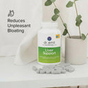 Dr. Emil Nutrition Liver Support supplement bottle with capsules on a white surface, featuring text about reducing unpleasant bloating.