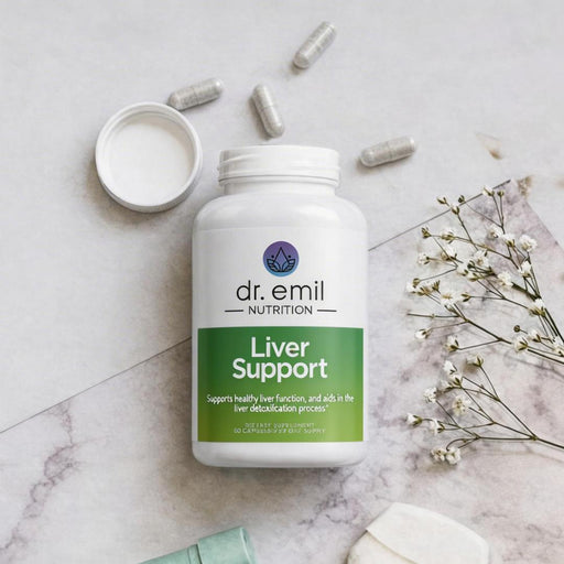 Bottle of dr. emil Nutrition Liver Support supplement on a marble surface with capsules and flowers.