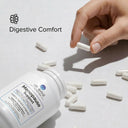 Hand picking a pill from a Menopause Support supplement bottle with 'Digestive Comfort' branding.