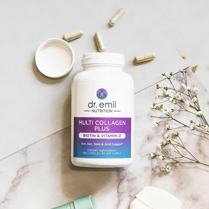 Dr. Emil Nutrition Multi Collagen Plus supplement bottle on a marble surface with capsules and flowers.