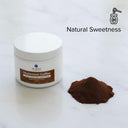 Jar of mushroom coffee with a scoop of powder on a white background