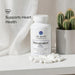Dr. Emil Nutrition Resveratrol Plus supplement bottle with capsules on a light surface, cactus plant in the background.