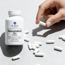 Dr. Emil Resveratrol Plus supplement bottle with pills on a light gray background