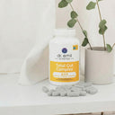 Dr. Emil Nutrition Total Gut Complex supplement bottle with capsules on a white surface.