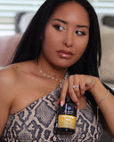 Woman holding a bottle of Dr. Emil Lions Mane in a casual setting